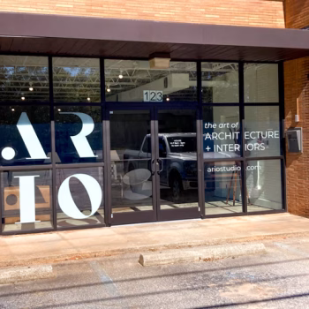 Minimalistic white vinyl on a storefront showcasing the logo and services provided by Ario in Traveler's Rest, SC.