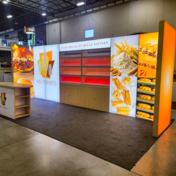Custom fabricated tradeshow display with lighted panels, shelving and a table for EPI Breads.