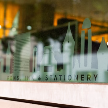 Custom cut window frosting on storefront windows of a stationery and pen company in downtown Greenville, SC.