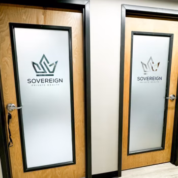 Custom window frosting with logo reverse cut from the material in an office in Greenville, SC.