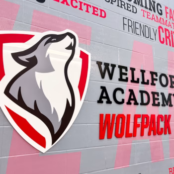 Custom word bubble wall mural with the Wellford Academy Wolfpack logo in dimensional acrylic in Wellford, SC.