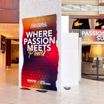 View of two full wall murals and a super-format banner at the 2024 Striking Brands convention.