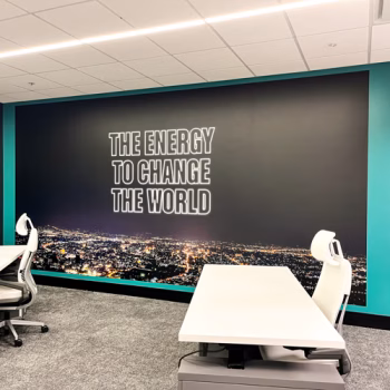 One of GE Vernova's slogans on a large wall mural in the customer center in Greenville, SC.
