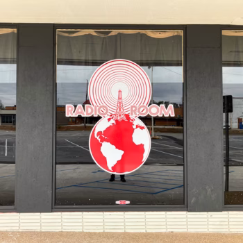 Radio Room vinyl logo on a large window on Radio Room's storefront in Greenville, SC.