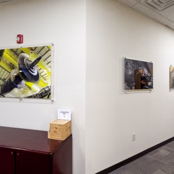 Three acrylic displays showcasing GE Vernova's products.