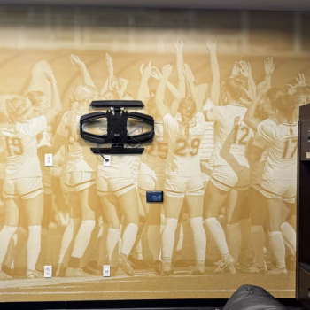 Locker room wall mural for Anderson University's women's soccer team showcasing an image of the team celebrating.