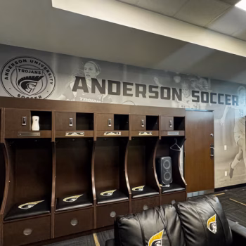 Locker room wall mural for Anderson University's women's soccer team showcasing an the team emblem and individual player images.