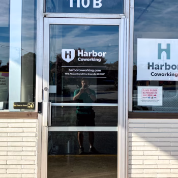 White vinyl door logo and office hour decals.