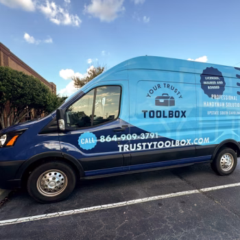 Full van wrap showcaseing Trusty Tool Box's vibrant blue colors and other branding.