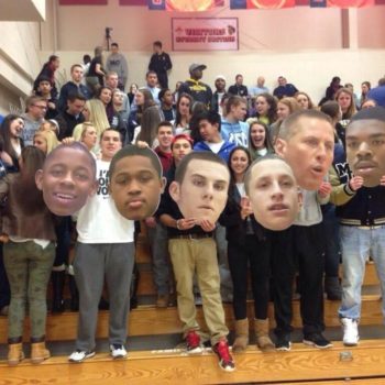 Students holding fatheads