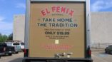 El Fenix truck promoting Take Home the Tradition meal deal and catering service.