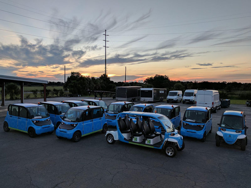 fleet wraps on golf carts at sunset