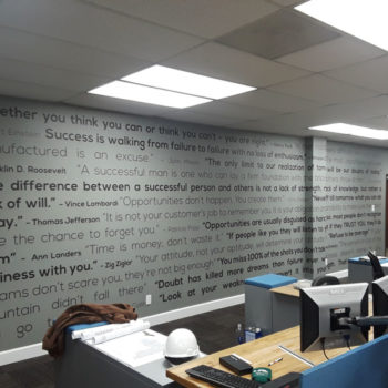Environmental graphic that contains inspirational quotes on an indoor office building wall
