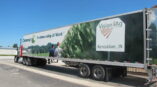Vinyl panel car warp on semi truck with company logo and graphics