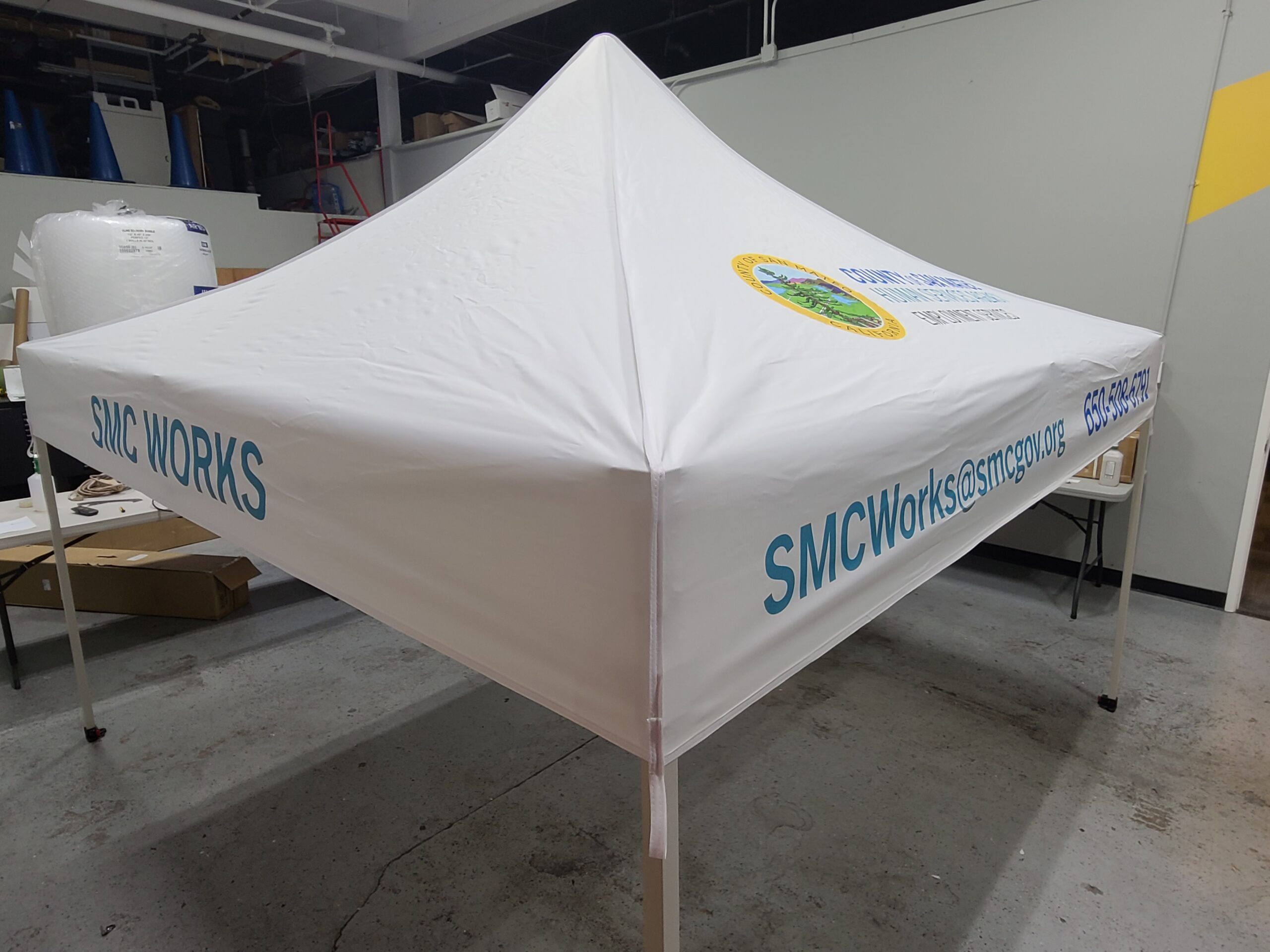 Outdoor display tent with graphics