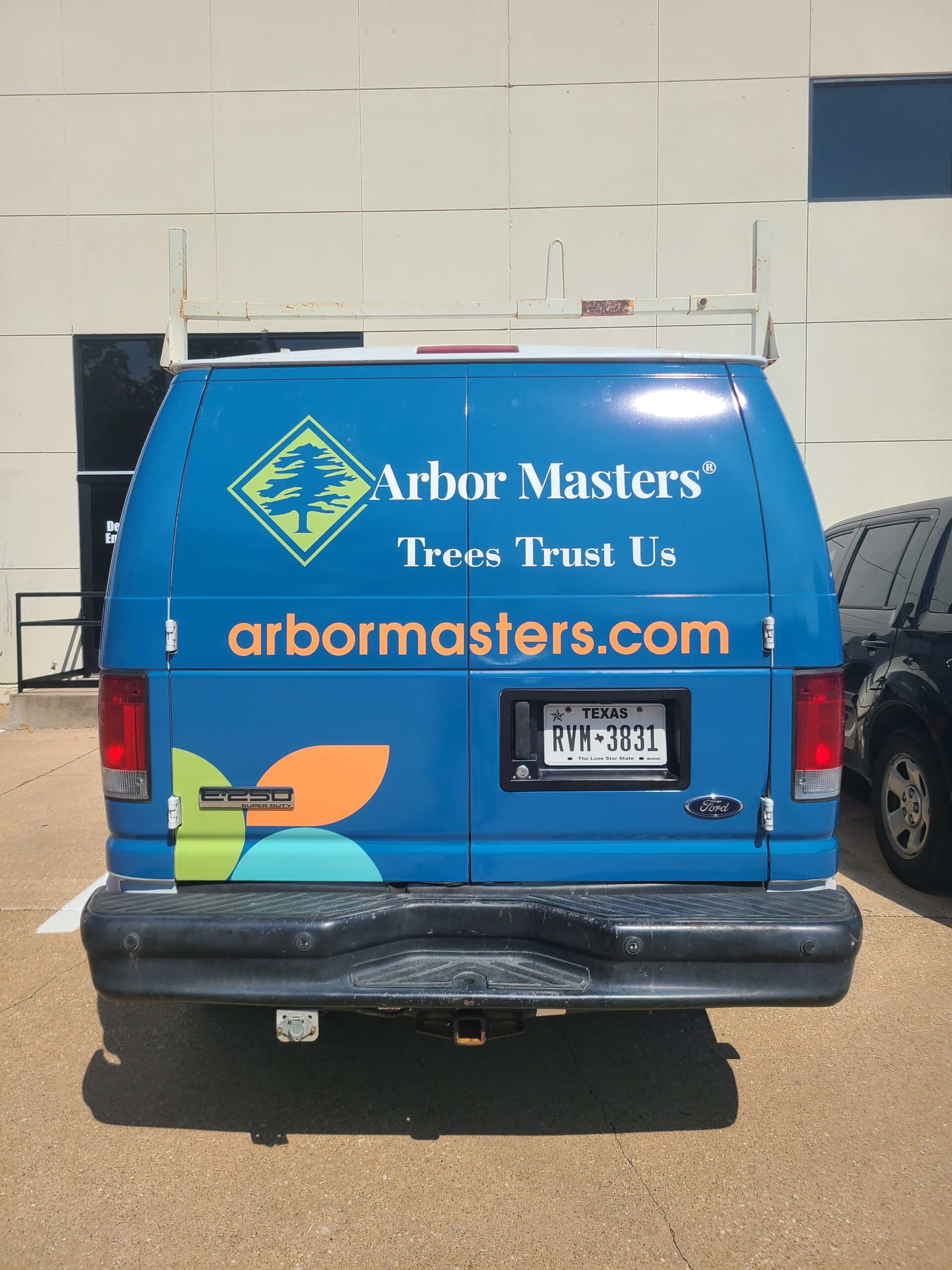 Back of full van vinyl car wrap with graphics and company logo