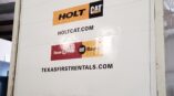 Commercial vehicle with vinyl decals on a machine, featuring box truck design