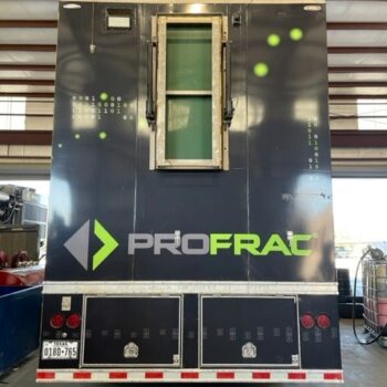 Back of a 54 foot data trailer with a panel car wrap with company logo and green graphics.