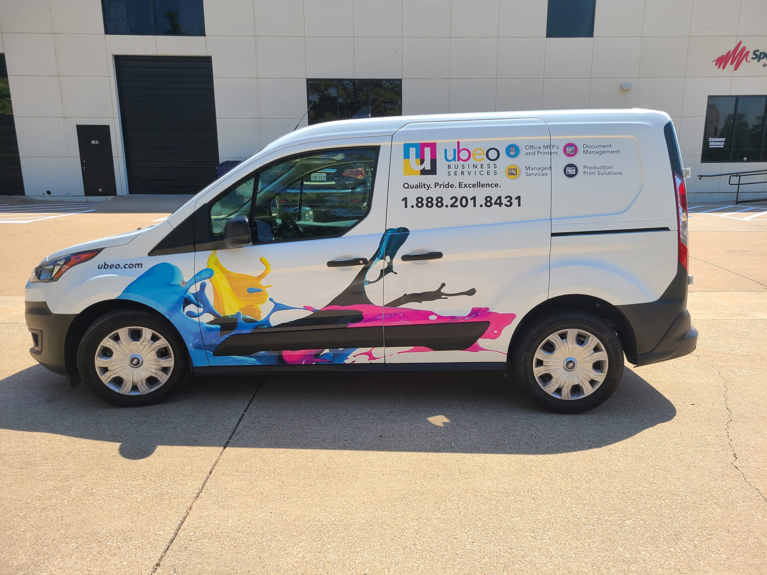 Full commercial vehicle wrap with company logo and colorful graphics