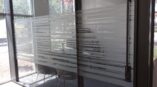 Frosted glass design across window panels and a door