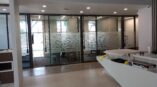 Modern interior design with elegant flooring and frosted glass elements.