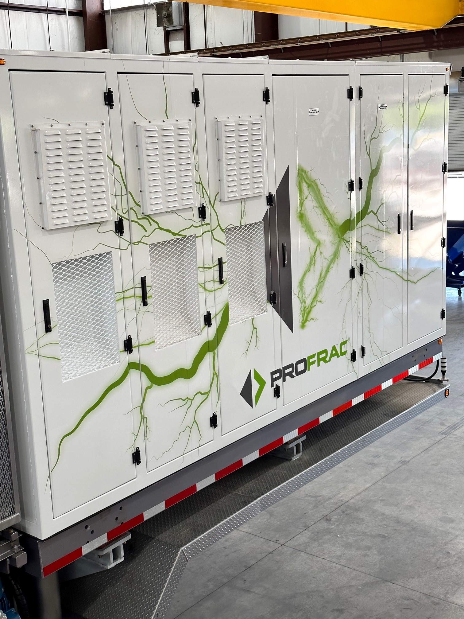 Vinyl wrapped generator with green lightning and the profrac logo.