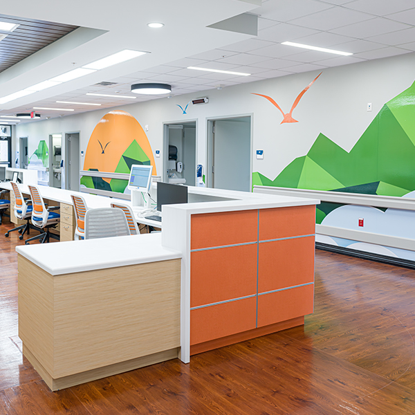 Modern interior design with unique ceiling and stylish flooring in a hospital setting.
