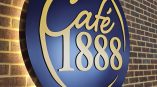 Custom illuminated wall sign for Café 1888 by SpeedPro Irving
