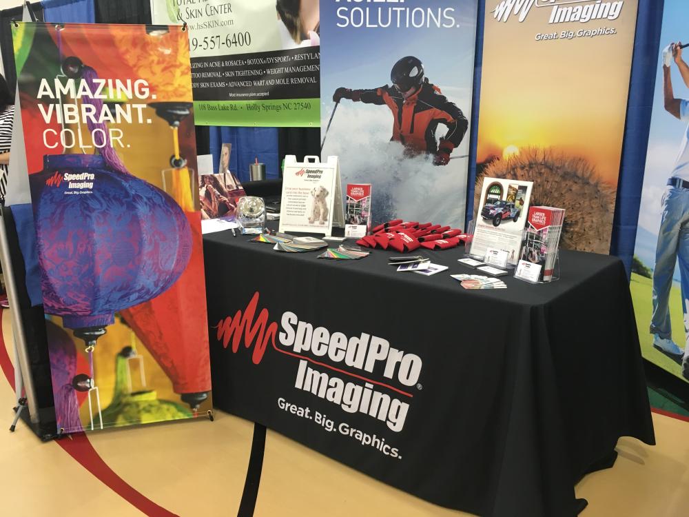 SpeedPro Imaging advertisement stand 