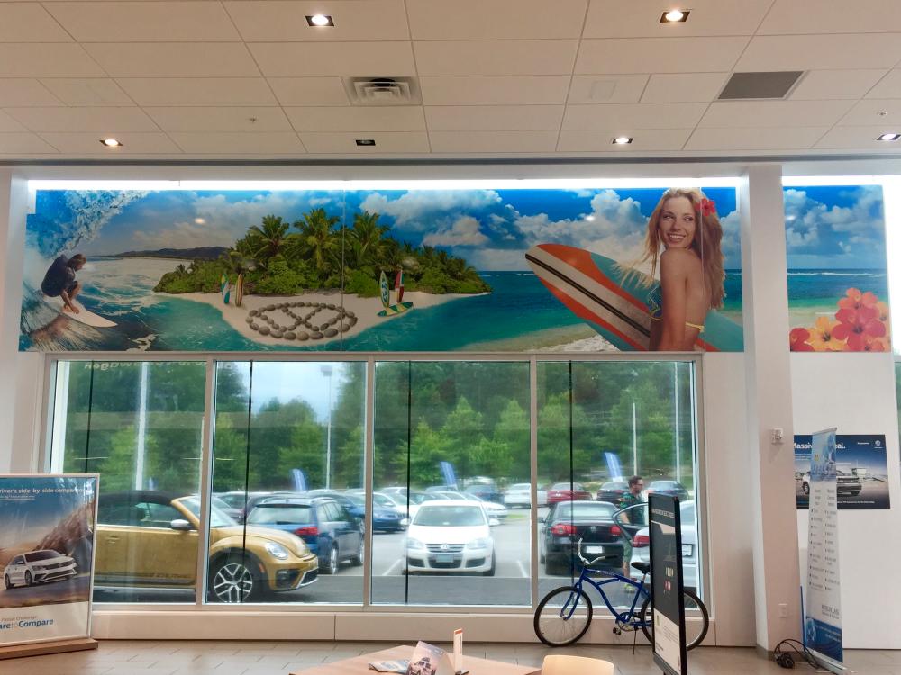 Beach scene printed mural in Volkswagen dealership  