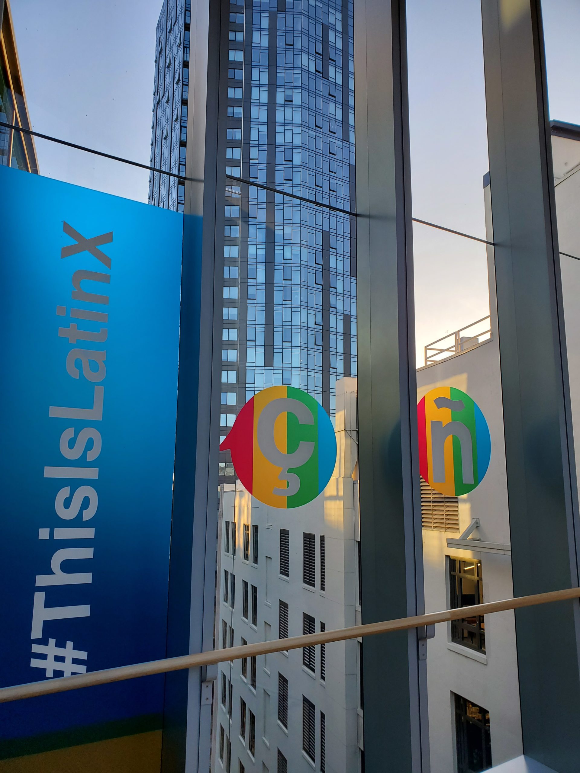 Vibrant window graphics on commercial building showcasing dynamic cultural designs