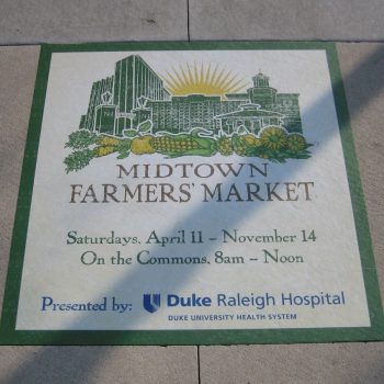 Square vinyl floor graphic with market illustration and text in Chicago, IL.