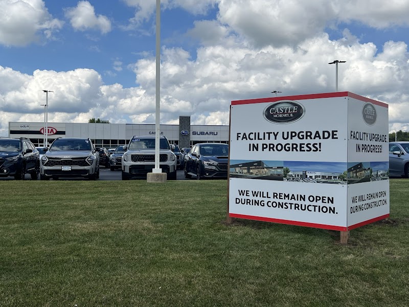 Large printed panel sign with construction notice on a grass lawn in Chicago, IL.