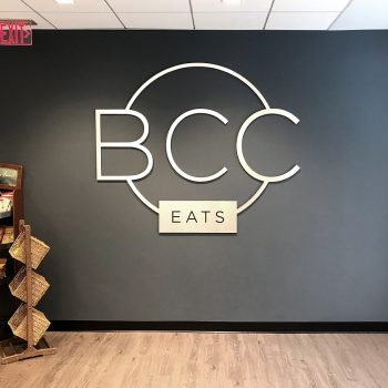 Dimensional wall sign with metal letters and circle design in Chicago, IL.
