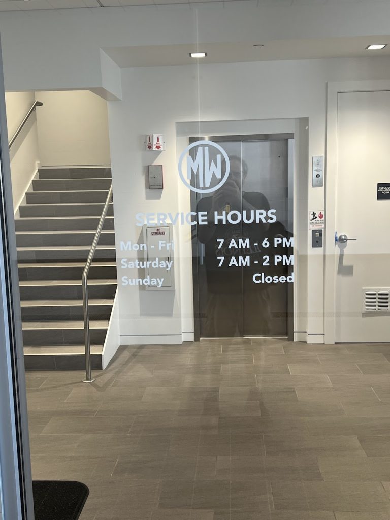 Frosted vinyl window graphics with logo and text in a building lobby in Chicago, IL.