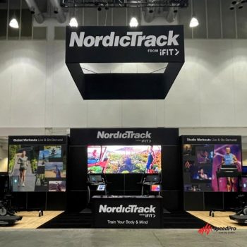 Trade show display with fabric banners and hanging frame in Chicago, IL.