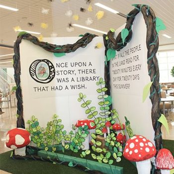 Three-panel printed fabric display with 3D mushroom and vine props in Chicago, IL.