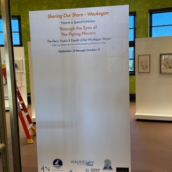 Large freestanding printed vinyl banner with logos and text in Chicago, IL.