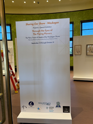 Large freestanding printed vinyl banner with logos and text in Chicago, IL.