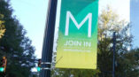 outdoor banner display hanging from light post