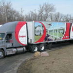 Eighteen-wheeler wrapped with custom graphics for Champion. 