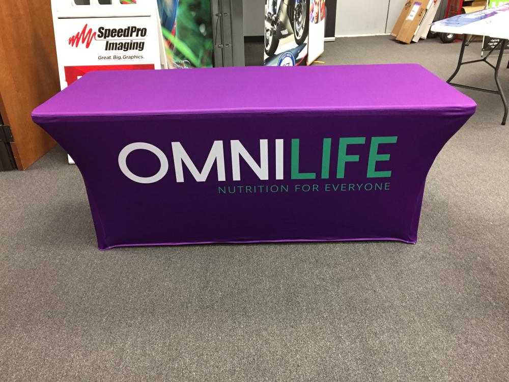 Advertising tabletop banner display showcasing Omnilife Nutrition for everyone