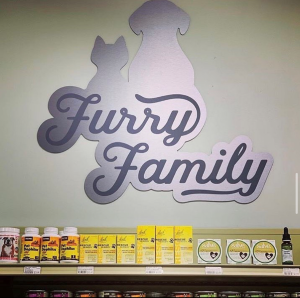Shelf with bottles and a stylish Font sign