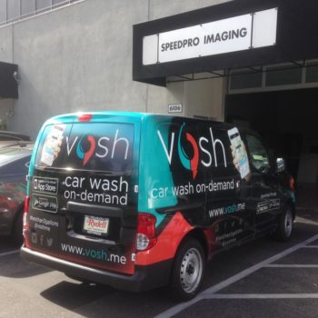 Car wash company advertisment vehicle wrap on van