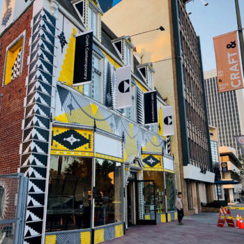 Creative brick building with yellow graphics