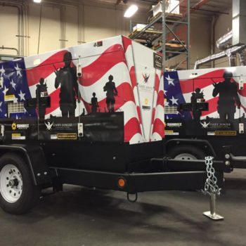 Trailers wrapped with an American flag graphic for the Gary Sinise Foundation