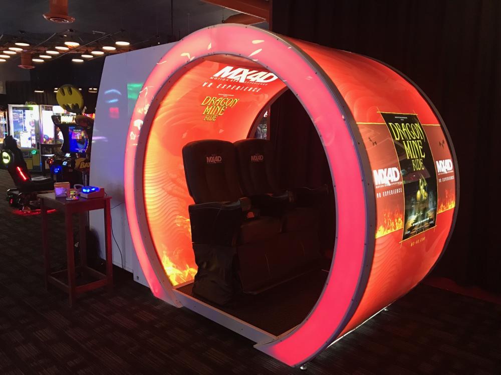 A VR experience pod wrapped with branding