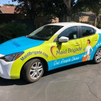 A vehicle wrapped for the Maid Brigade