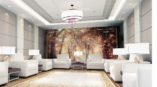 Hotel sitting area with wall mural of forest