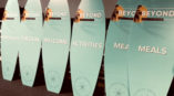 Surf boards with location graphics applied to them